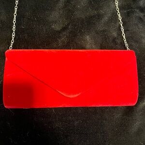 Red velvet clutch bag with silver chain strap